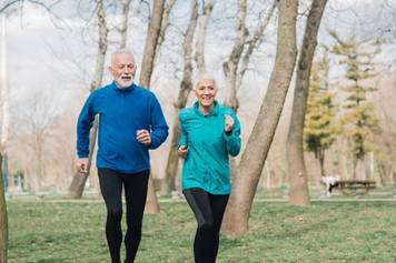 House of Hearing Richfield Utah - An older couple jogging in the park.