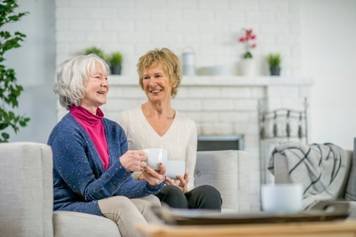 House of Hearing Richfield Utah - Two women talking at a cafe.